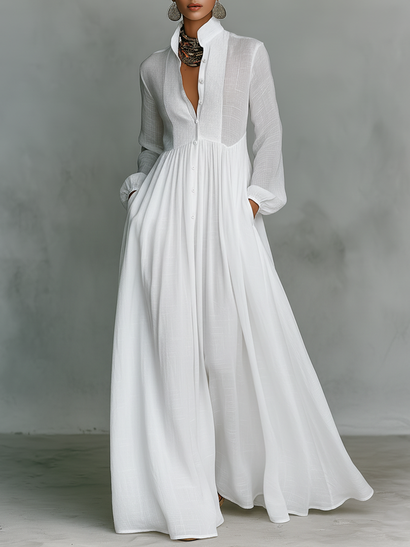 Vestido maxi minimalista de algodón y lino con patchwork, cuello alto y manga larga