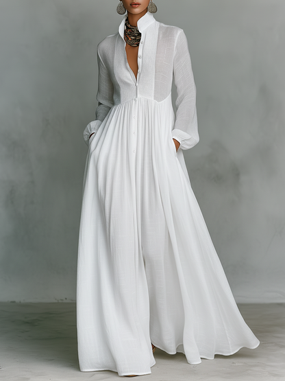 Vestido maxi minimalista de algodón y lino con patchwork, cuello alto y manga larga