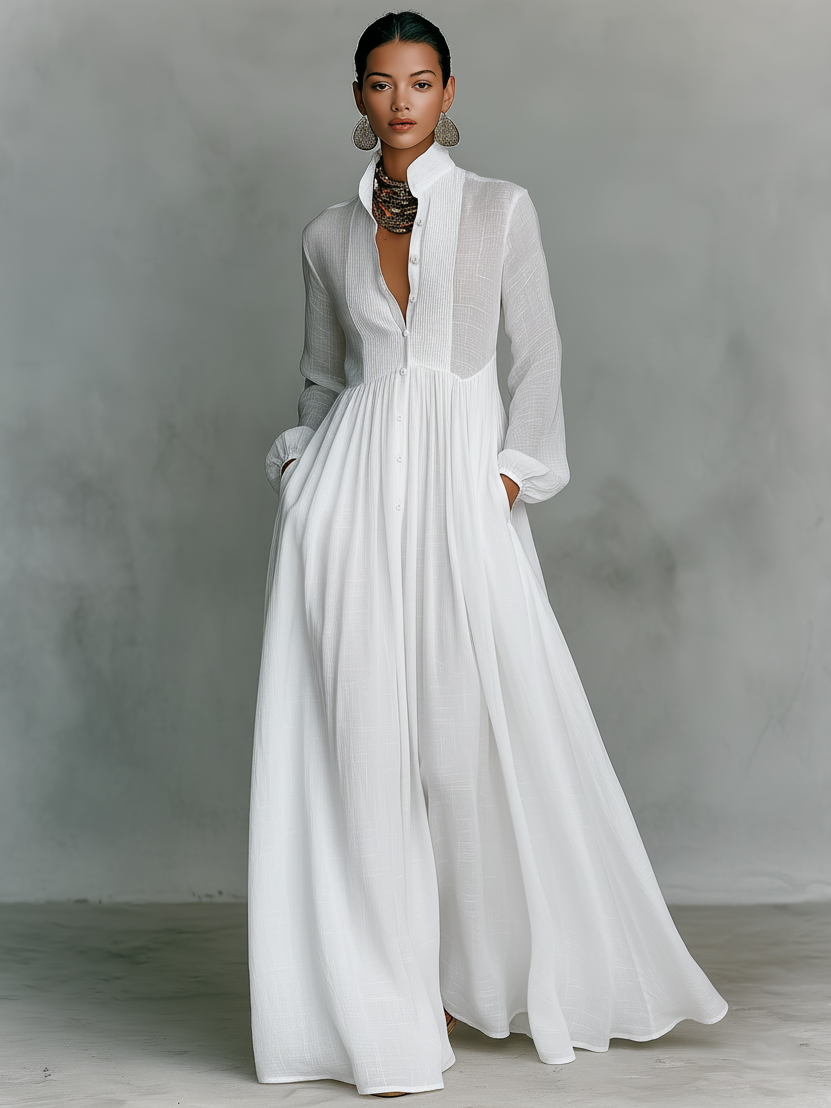 Vestido maxi minimalista de algodón y lino con patchwork, cuello alto y manga larga