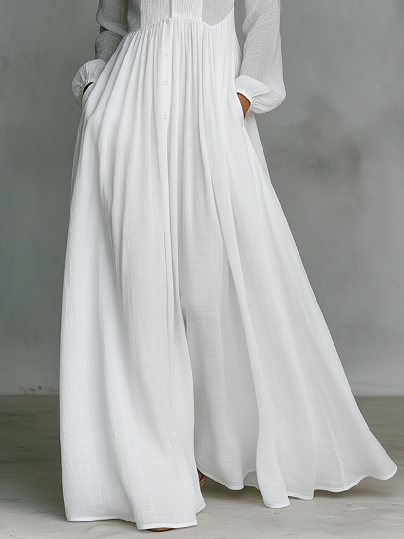 Vestido maxi minimalista de algodón y lino con patchwork, cuello alto y manga larga